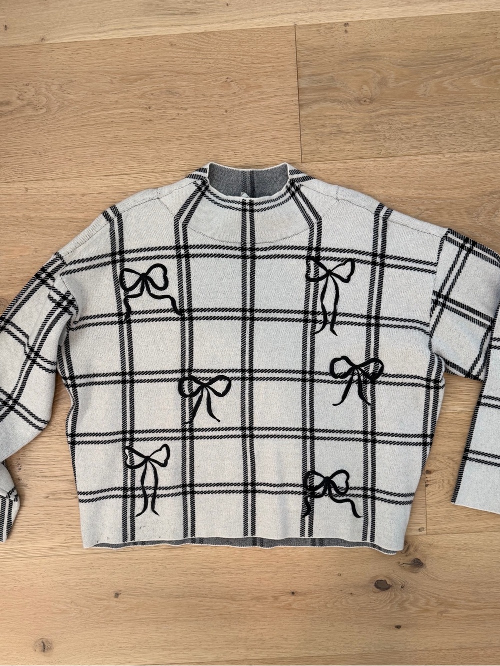 Anthropologie Maeve White mockneck Sweater with Black Plaid & Bow Embroidery